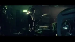 man speaking into microphone in workshop — John Wick