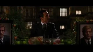 man giving speech behind podium — Batman: The Dark Knight Rises