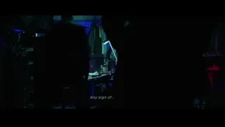 man working on computer with John Wick sign — John Wick