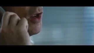 man talking on phone by window — The Big Short