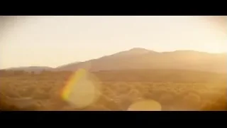 Sunset over desert mountain range — Ford v Ferrari