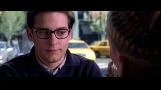 young man at restaurant table looking at camera — Spider Man 2