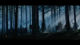 people walking through dark foggy forest — Gladiator