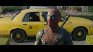 Deadpool holding swords in front of taxi — Deadpool 2