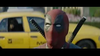 Deadpool with swords by yellow taxi — Deadpool 2