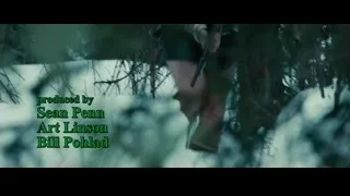 Man in sweater standing in forest — Into the Wild