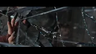 hand reaching through shattered glass window — Doctor Strange 2