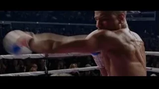 two boxers fighting in a ring — Creed