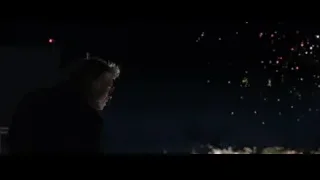 person watching colorful fireworks in night sky — Iron Man 3