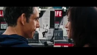 woman by wall with LIFE posters — The Secret Life of Walter Mitty