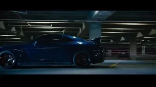 man in empty parking garage — Furious Seven