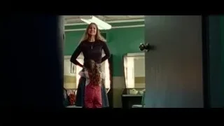 woman holding child in green room — Steve Jobs