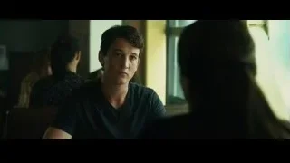 man and woman talking in dimly lit restaurant — Whiplash