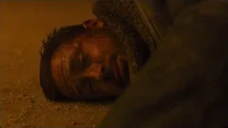 Bloody man lying on ground distressed — Blade Runner 2049