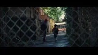 man and boy walking in narrow alleyway — The Amazing Spider Man 2