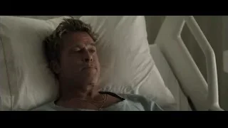 man lying in hospital bed — F1