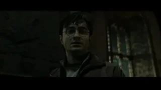 Harry Potter standing in dimly lit room — Harry Potter and the Deathly Hallows 2