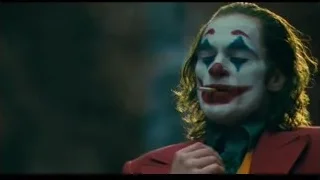 Joker in red suit smiling — Joker