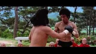 Bruce Lee fighting with sword watched by monks — Bruce Lee: Enter The Dragon