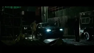 black SUV parked in dimly lit garage — Now You See Me 2