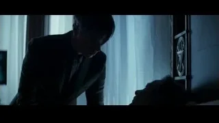 man leaning over window in dark room — The Amazing Spider Man 2