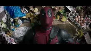 Deadpool standing by trash pile — Deadpool