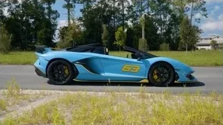 blue sports car with yellow stripe — Sports Cars