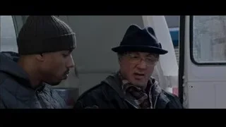 two men sitting in a van — Creed