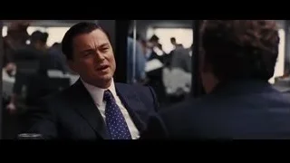 Man in suit deep in thought at restaurant — The Wolf Of Wall Street