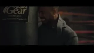 man leaning against punching bag in boxing ring — Creed 2