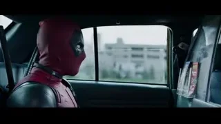Deadpool mask driver looking out car window — Deadpool
