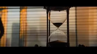 man standing by window with hourglass — John Wick: Chapter 4