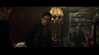 Man standing in dimly lit room with chandelier — Now You See Me 2