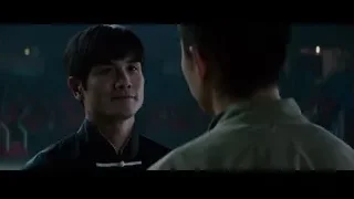 two men in traditional Chinese outfits talking — Bruce Lee: Birth of The Dragon