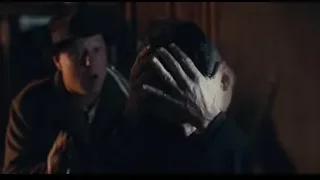 Man in distress with head in hands in dark room — Peaky Blinders