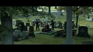 casket with flowers in cemetery — Southpaw