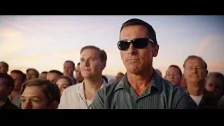 man standing in front of a crowd — Ford v Ferrari