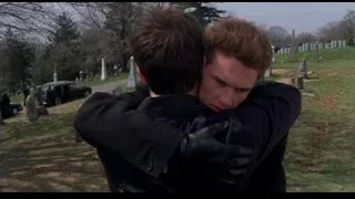 two young men embracing in cemetery — Spider Man