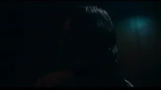 man singing on stage with microphone — Joker